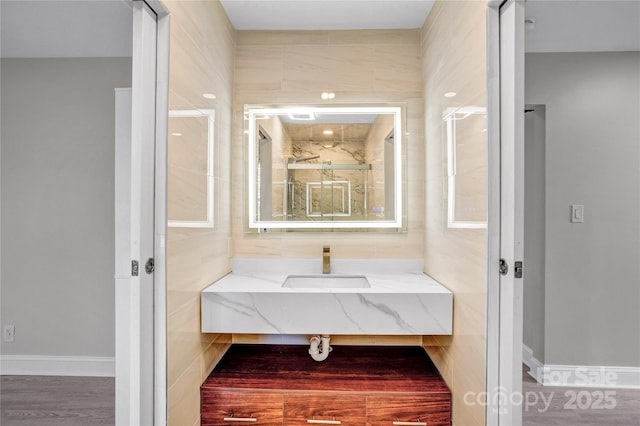 bathroom featuring vanity and a stall shower