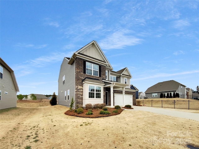 view of front of house with fence, board and batten siding, concrete driveway, a garage, and brick siding