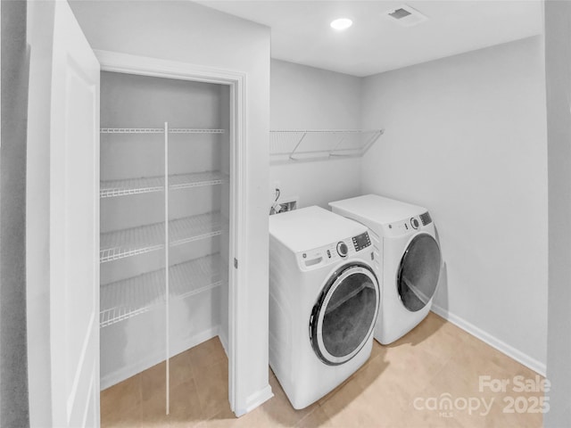 laundry area featuring baseboards, visible vents, washing machine and clothes dryer, laundry area, and recessed lighting