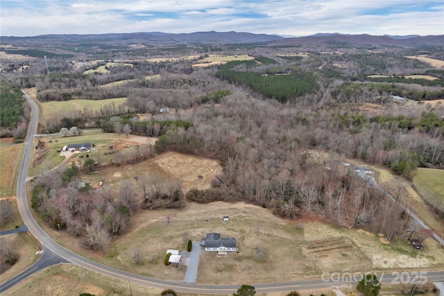 drone / aerial view featuring a mountain view