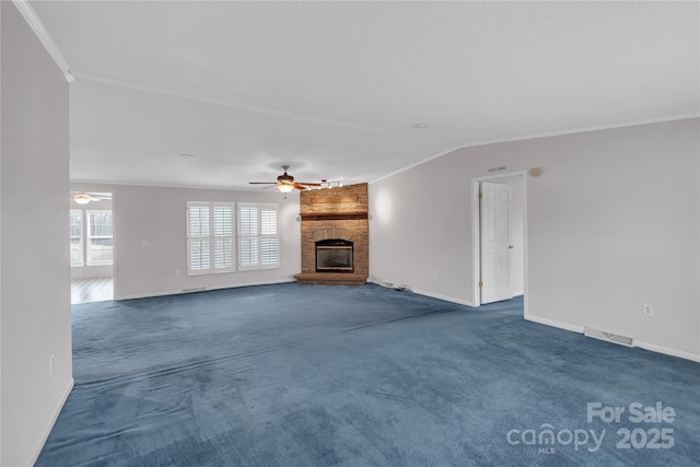 unfurnished living room with crown molding, visible vents, dark colored carpet, and ceiling fan