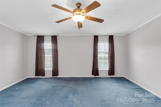 carpeted spare room with a wealth of natural light and ornamental molding