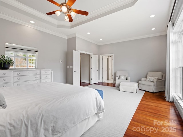 bedroom featuring recessed lighting, wood finished floors, crown molding, and ceiling fan