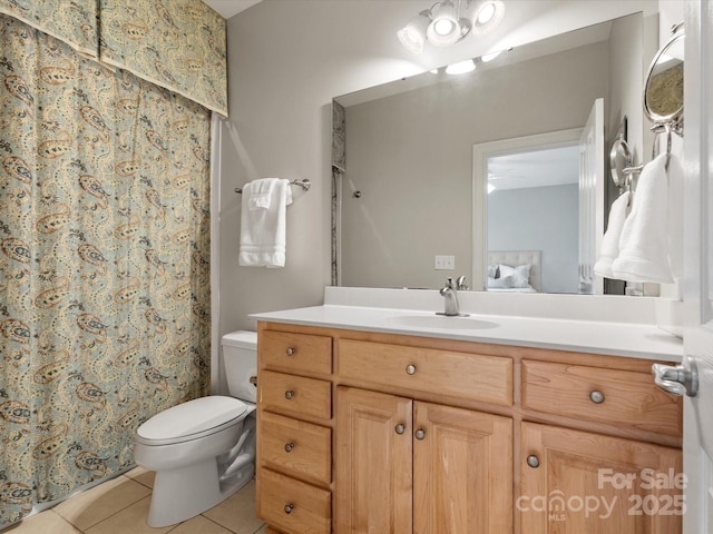 bathroom featuring vanity, a shower with shower curtain, ensuite bath, tile patterned flooring, and toilet