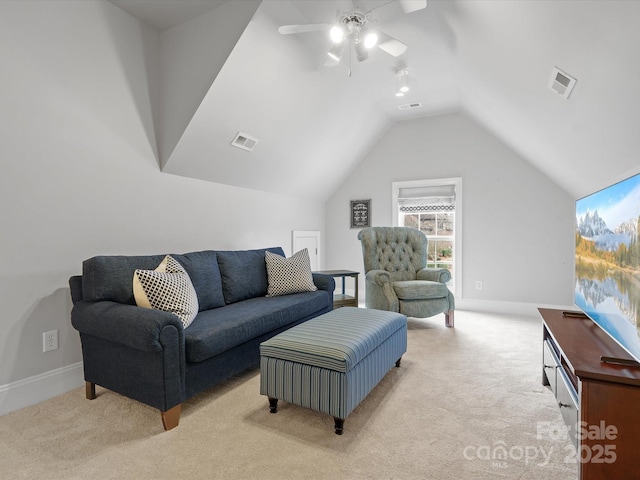 living area featuring a ceiling fan, vaulted ceiling, light colored carpet, and visible vents