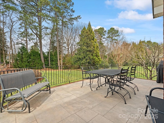 view of patio / terrace featuring outdoor dining space and fence