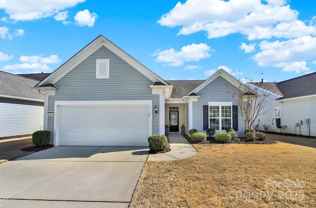 single story home with a front yard, concrete driveway, and an attached garage