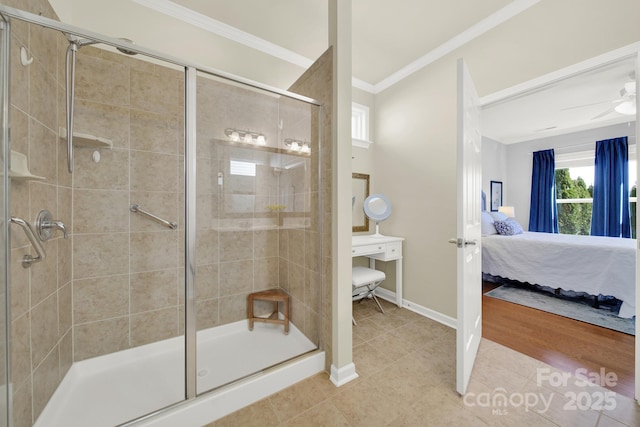 bathroom featuring a stall shower, connected bathroom, crown molding, tile patterned flooring, and baseboards