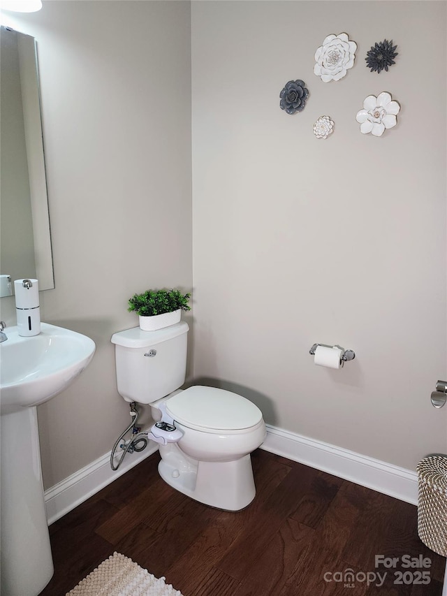 3500 Exbury Gardens Dr, Waxhaw, NC 28173 - bathroom featuring baseboards, wood finished floors, and toilet