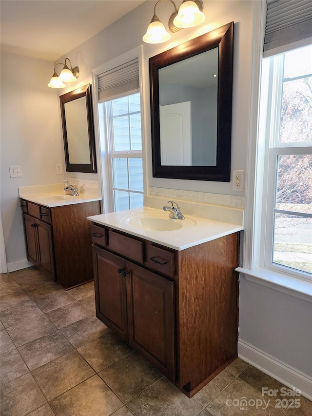 3500 Exbury Gardens Dr, Waxhaw, NC 28173 - bathroom with a sink, two vanities, and a healthy amount of sunlight