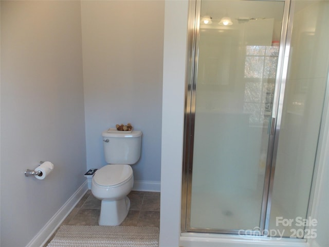 3500 Exbury Gardens Dr, Waxhaw, NC 28173 - bathroom with tile patterned flooring, toilet, a stall shower, and baseboards