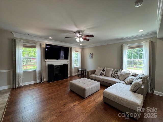 3500 Exbury Gardens Dr, Waxhaw, NC 28173 - living area with a ceiling fan, healthy amount of natural light, a fireplace with flush hearth, crown molding, and recessed lighting