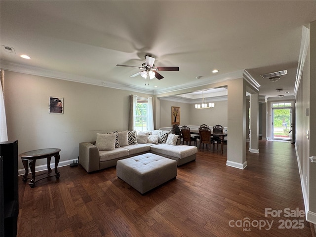 3500 Exbury Gardens Dr, Waxhaw, NC 28173 - living room with plenty of natural light, dark wood-style floors, a ceiling fan, baseboards, and crown molding