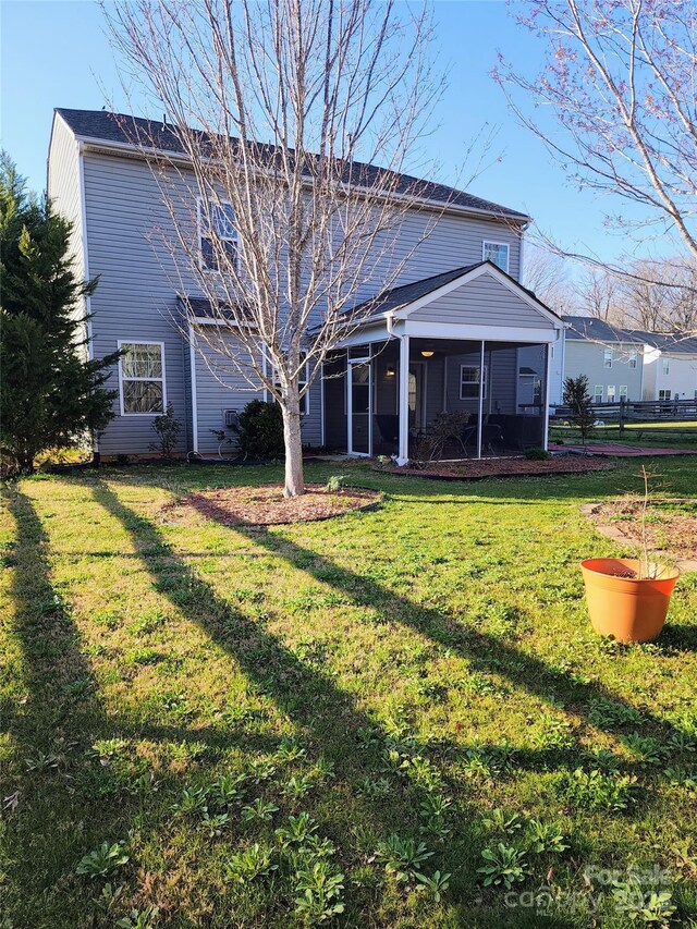 3500 Exbury Gardens Dr, Waxhaw, NC 28173 - rear view of house featuring a sunroom and a yard