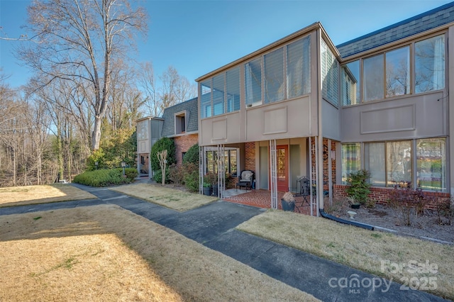 view of front of house with brick siding