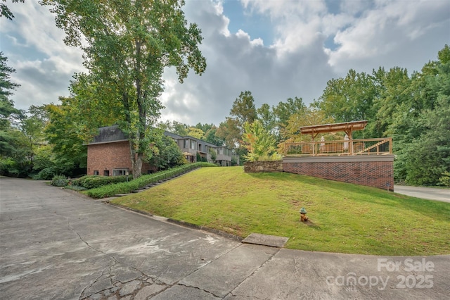 exterior space with a front lawn and brick siding