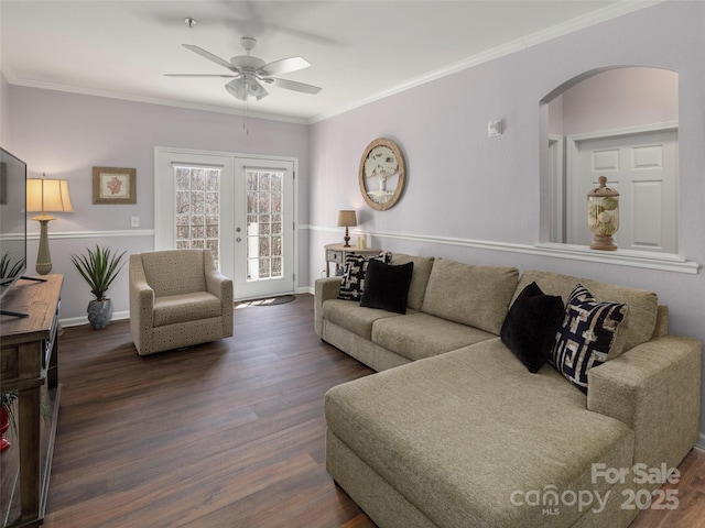 living room with a ceiling fan, arched walkways, dark wood-type flooring, french doors, and crown molding