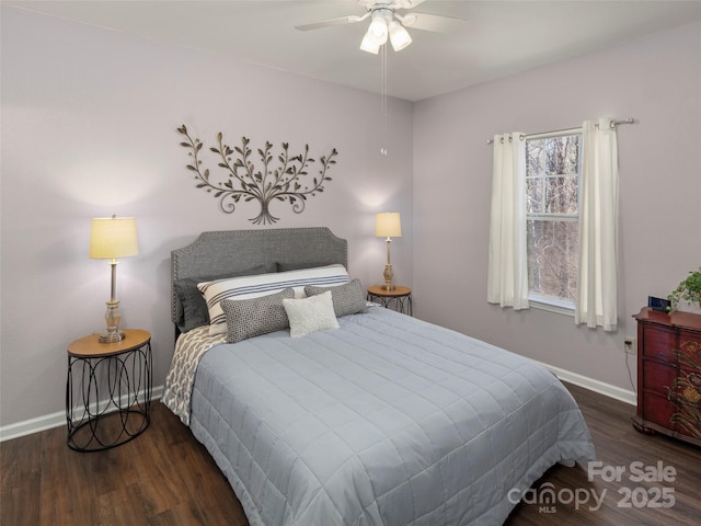 bedroom featuring ceiling fan, baseboards, and wood finished floors