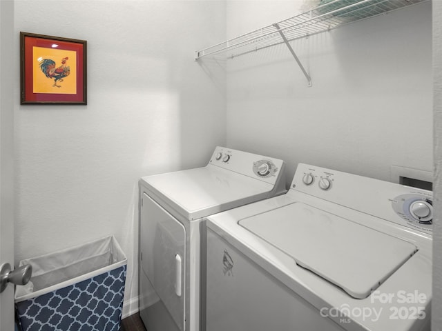 washroom with laundry area and washer and dryer