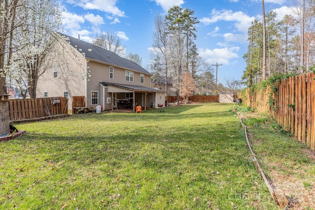 view of yard with a fenced backyard