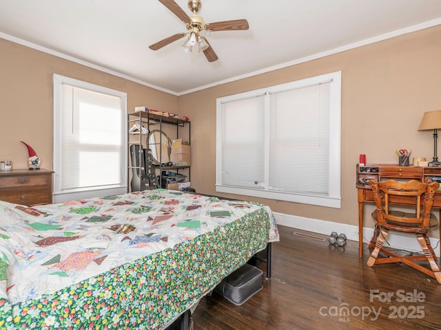 bedroom featuring a ceiling fan, crown molding, wood finished floors, and baseboards