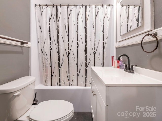 bathroom with vanity, toilet, and shower / bath combo