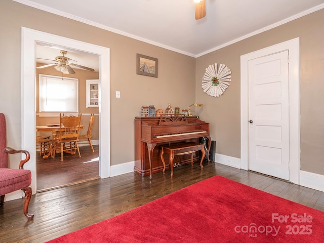 living area with ceiling fan, ornamental molding, and hardwood / wood-style flooring