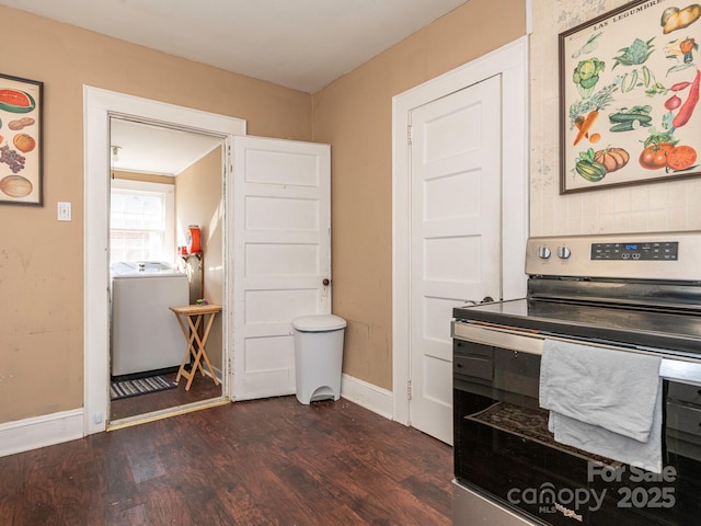 interior space with baseboards, washer / clothes dryer, stainless steel electric range, and dark wood-style flooring