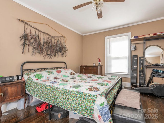 bedroom featuring a ceiling fan, wood finished floors, baseboards, and ornamental molding