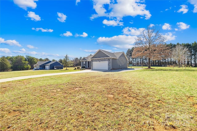 view of front of property with stone siding, driveway, an attached garage, and a front lawn