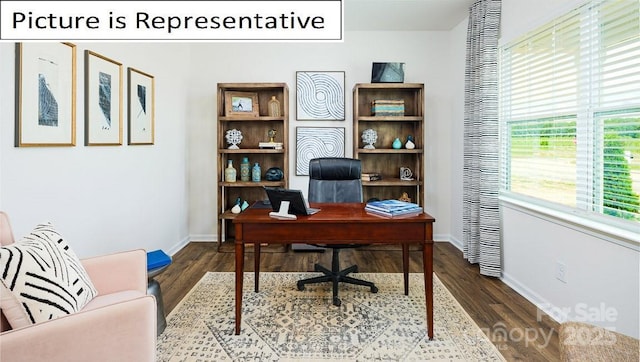 office area with wood finished floors and baseboards