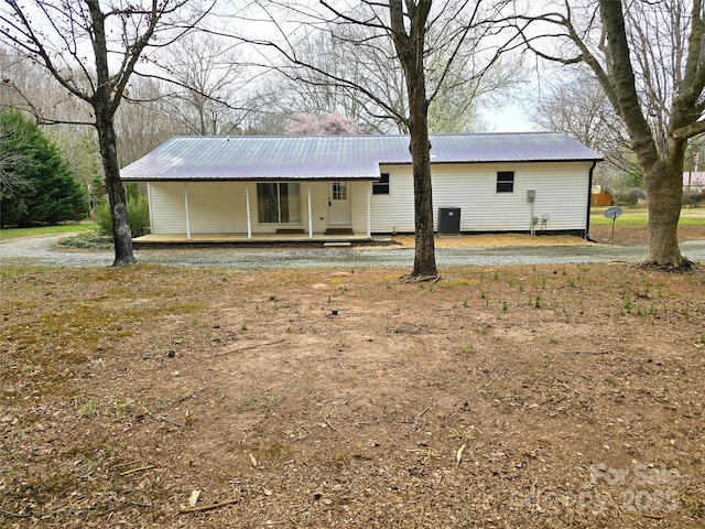 rear view of house with metal roof