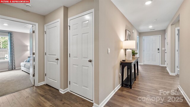 hall with recessed lighting, baseboards, and wood finished floors