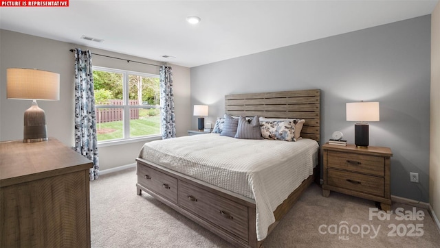 bedroom featuring visible vents, light colored carpet, and baseboards