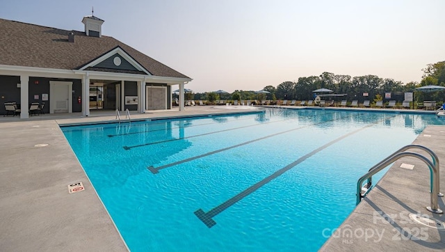 community pool with a patio area