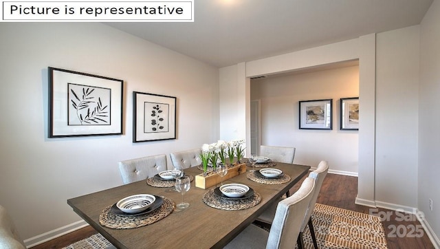 dining room featuring baseboards and wood finished floors