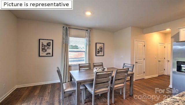 dining room with dark wood-type flooring and baseboards