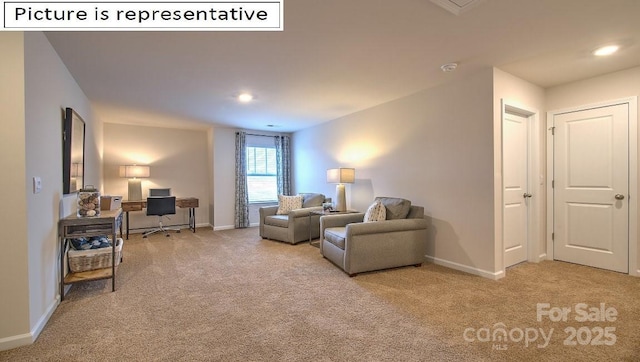 carpeted living area featuring recessed lighting and baseboards