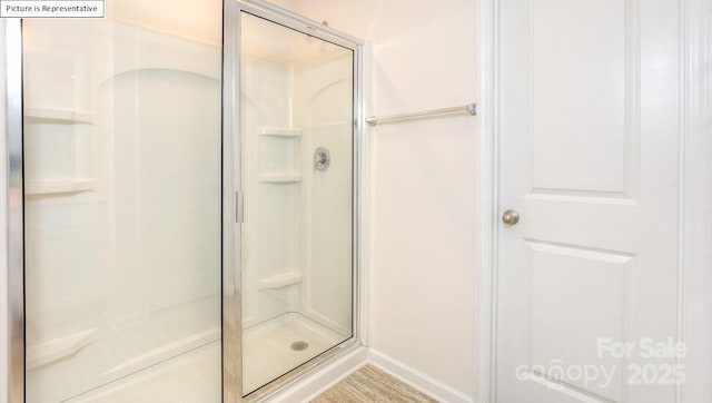 bathroom featuring a shower stall