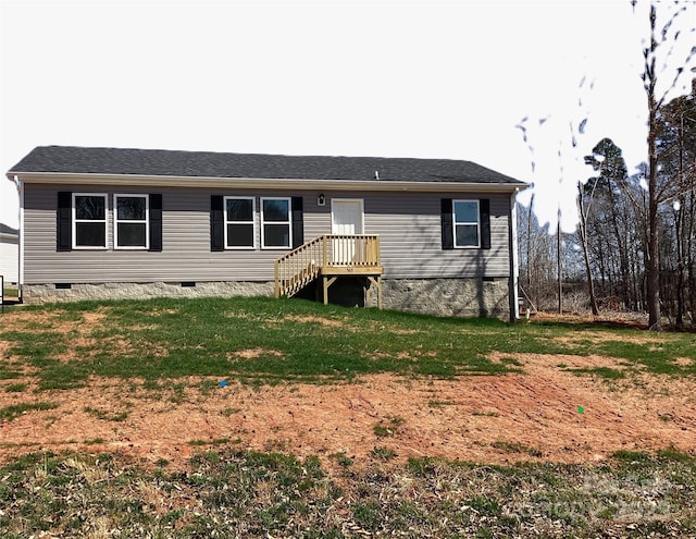 view of front of house with a front lawn and crawl space