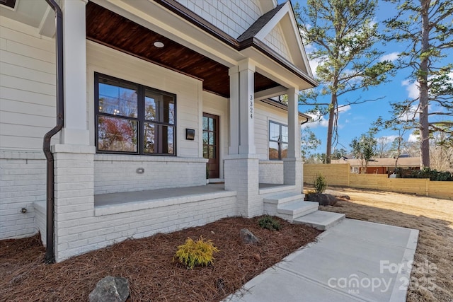 doorway to property with a porch