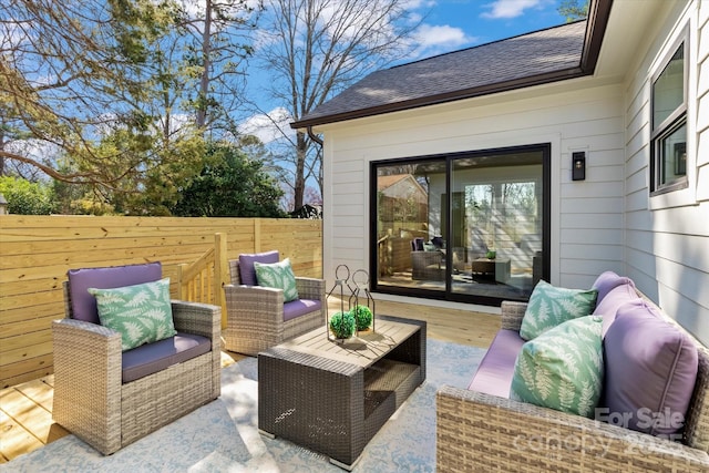 view of patio / terrace featuring outdoor lounge area and fence