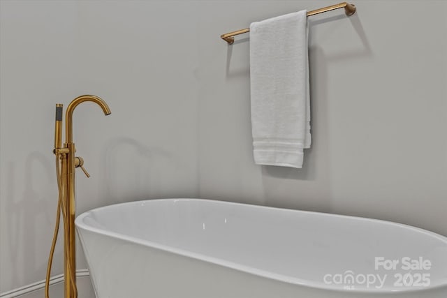 bathroom with a freestanding tub