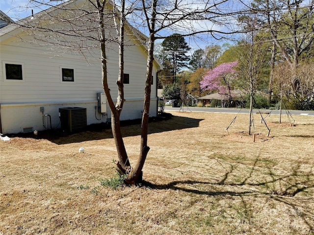 view of property exterior with central AC