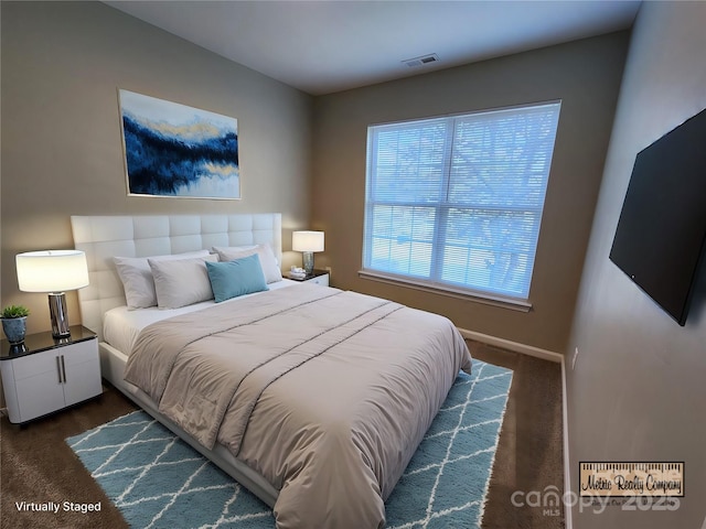 carpeted bedroom with visible vents