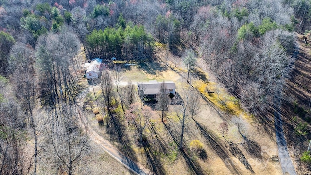 drone / aerial view featuring a view of trees