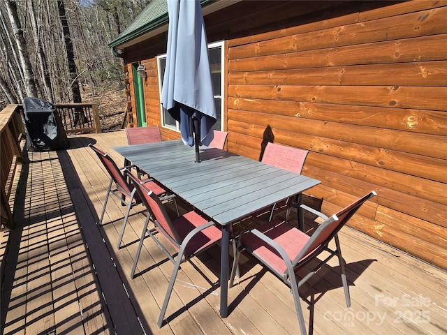 deck with outdoor dining space