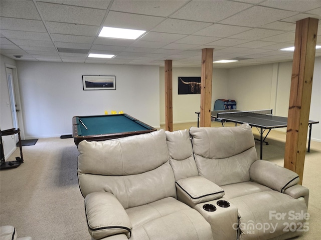 rec room with a drop ceiling, baseboards, and carpet flooring