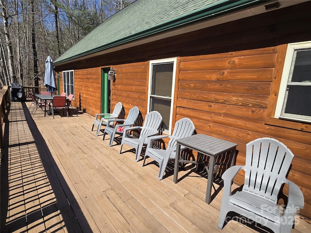 wooden deck with outdoor dining space