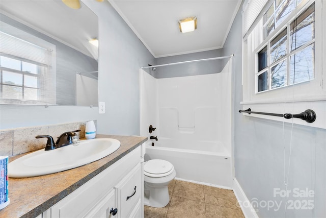 full bath featuring tile patterned floors, toilet, ornamental molding, bathing tub / shower combination, and vanity